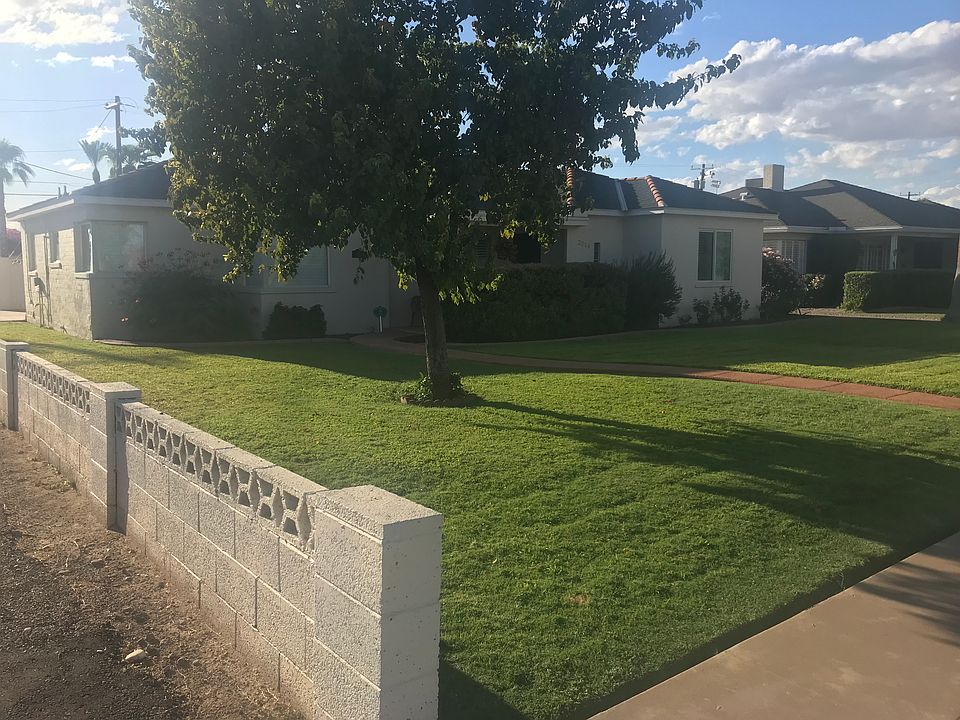 Outside: Property in the afternoon, alleyway access to garage