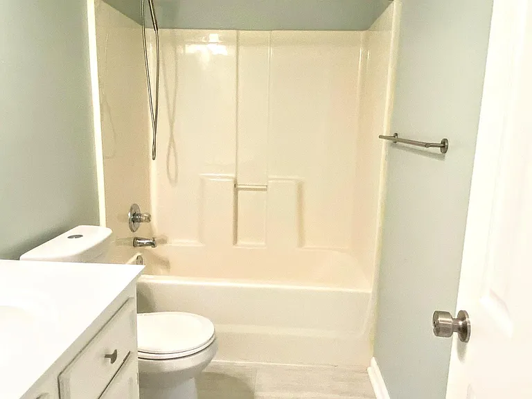 Second bathroom off of the hall adjacent to both the second and third bedrooms.