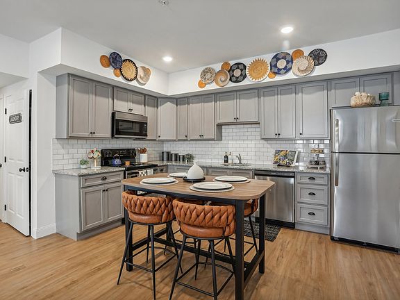 Designer Custom Kitchens with Granite Counters, Subway Tile and Stainless Steel Appliances