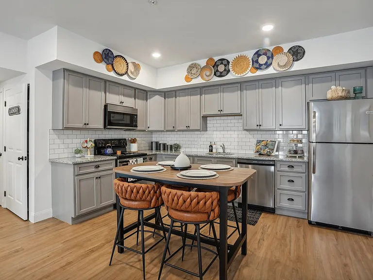 Designer Custom Kitchens with Granite Counters, Subway Tile and Stainless Steel Appliances