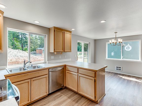Full size dining room with a sliding glass door to the rear patio