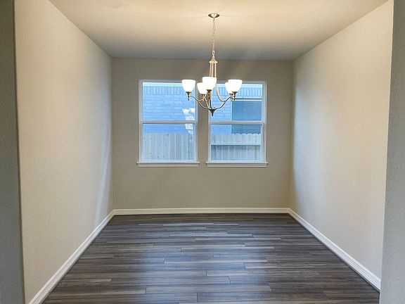 Formal dining room with modern chandelier