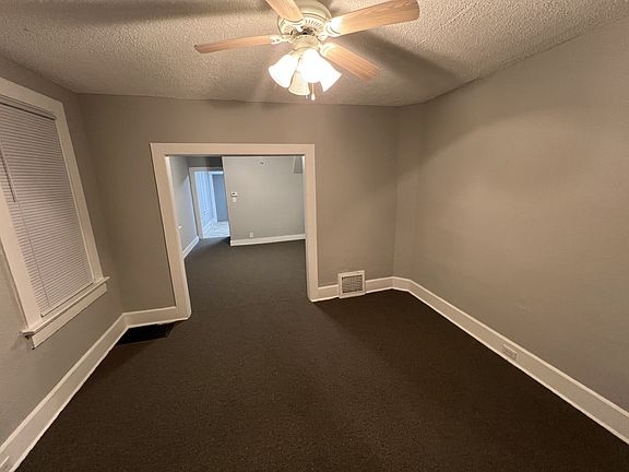 looking into second room, kitchen entry far left corner