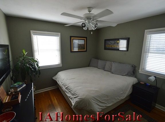 Large master bedroom with original refinished hardwood floors. Comfortably fits king-size bed and furniture.