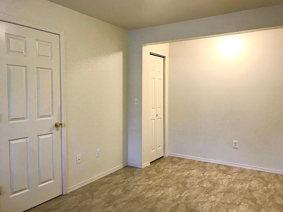 Living room, with bathroom to left and storage closet on rear left.