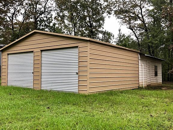 Detached 2 car garage and shop area.