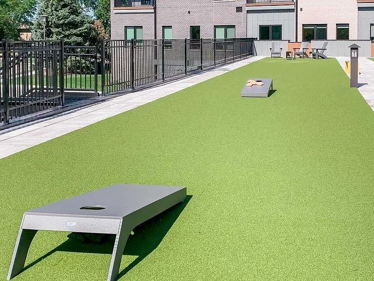Challenge a neighbor to a friendly game of bags on our courtyard turf.