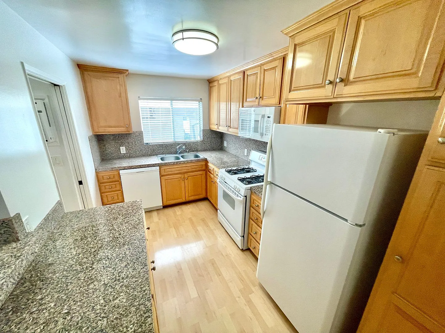 A beautiful lower unit with lots of storage, one covered parking and combo washer/dryer — Photo 2