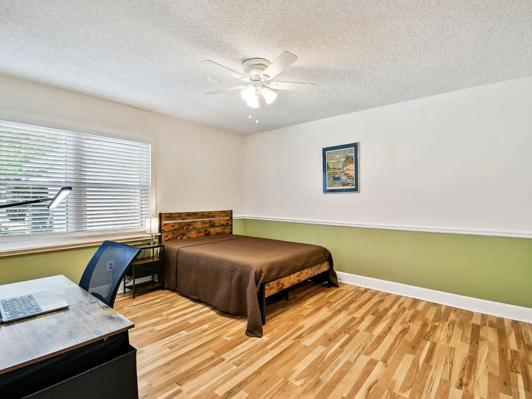 Full size cozy full size bed, with end table, light, desk, office chair and light, storage container under the bed and large
