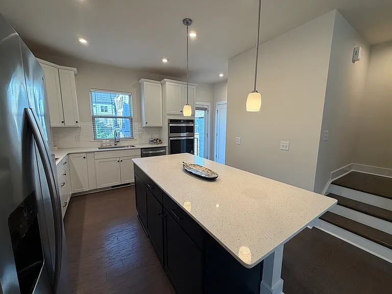 Large kitchen that leads to a balcony
