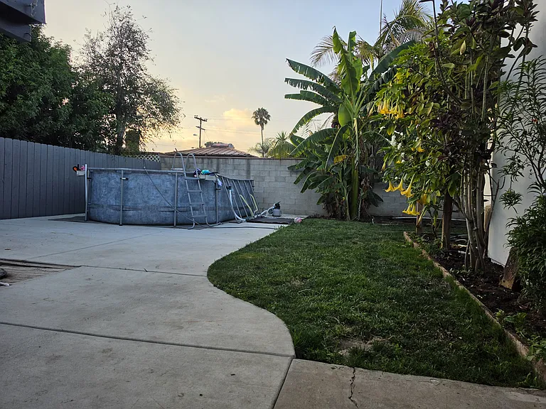 Backyard behind garage