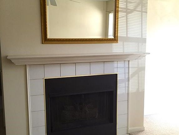 The living area features a functional gas fireplace that offers a focal point to the room and an additional source of heat.
