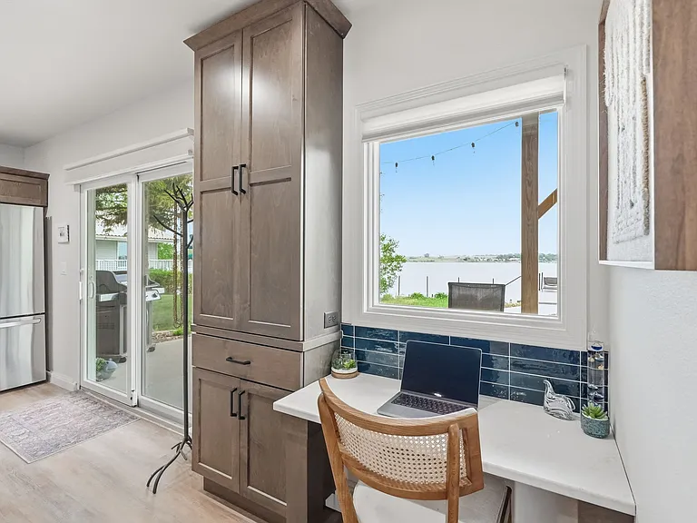 Lake view from the dedicated working desk w/ quartz top.