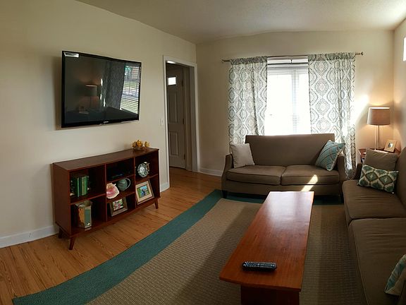 Living room. The large window is a bay window and faces Lassiter St.