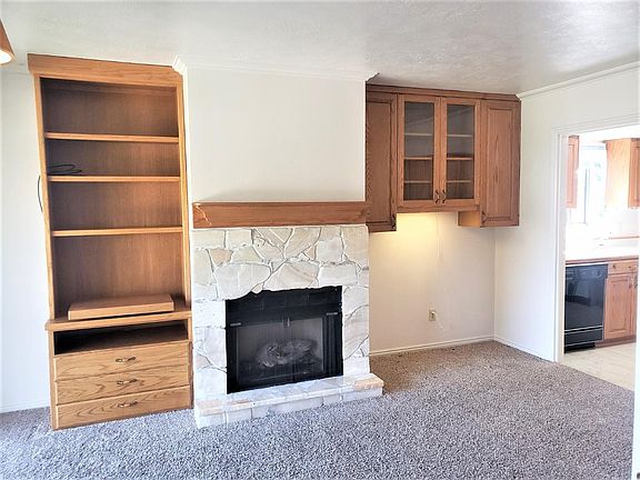 Living room with builtins and gas fireplace