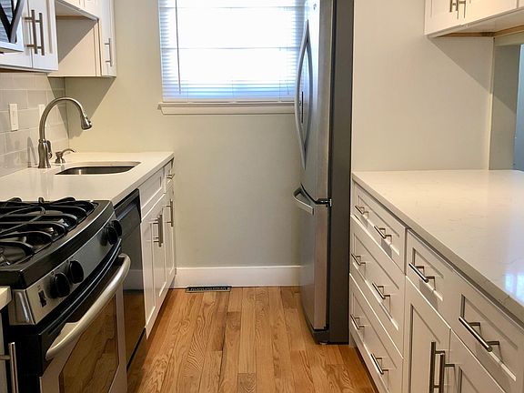 Grocery runs are easy with a pass-through kitchen near the entrance.