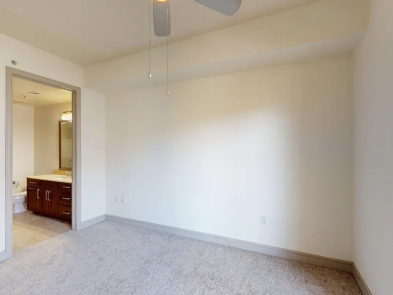 Spacious apartment Bedroom with Carpet Floor.