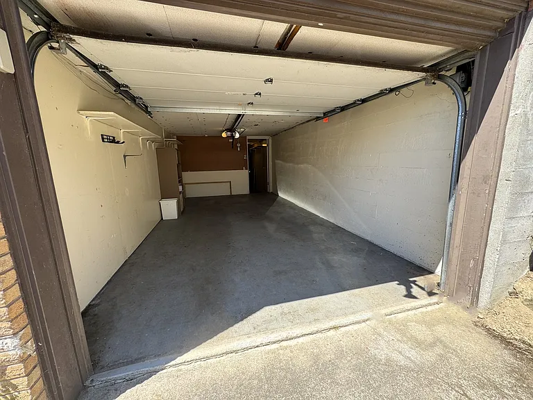 Garage with entrance into laundry room
