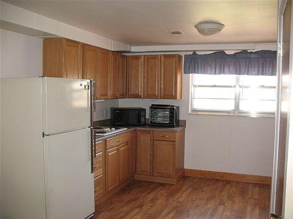 This shows half of the kitchen. Windows face south. Plenty of room for dining table, shown in next photo.