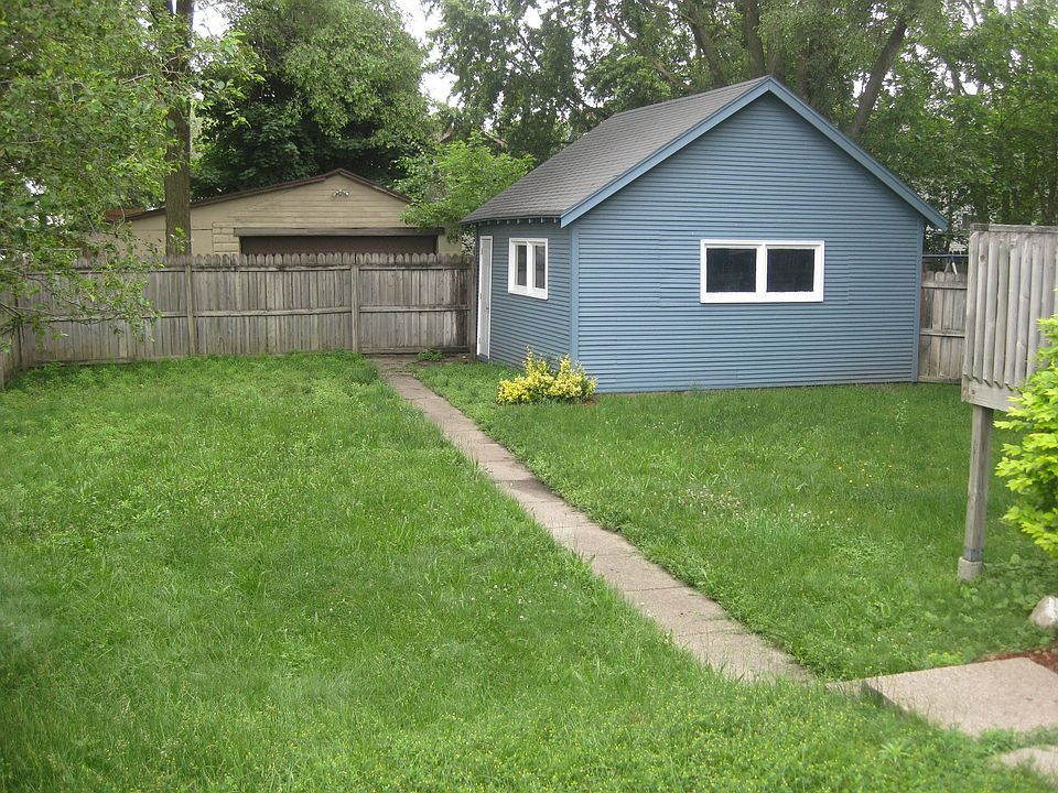 Big fenced in back yard with a deck
