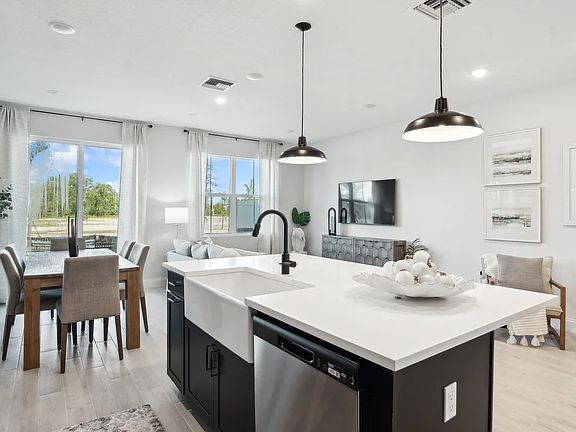 Kitchen with white apron sink