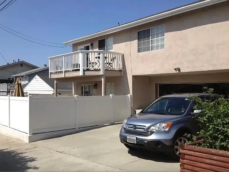 Parking: Two car garage plus two parking spaces in front of the garage in the alley behind the home