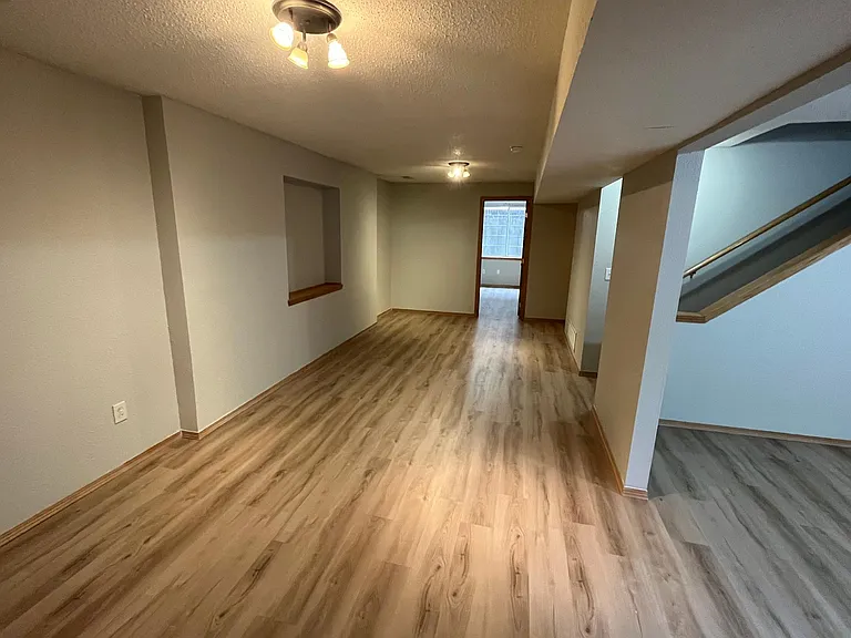 basement with bedroom through the door