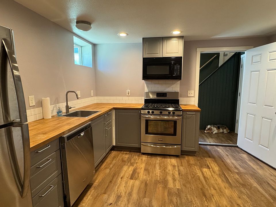 Full kitchen with new appliances. Dishwasher, gas stove, fridge, and built in microwave.