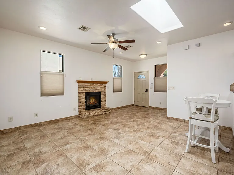 Gas fireplace in the open living/dining/kitchen area.