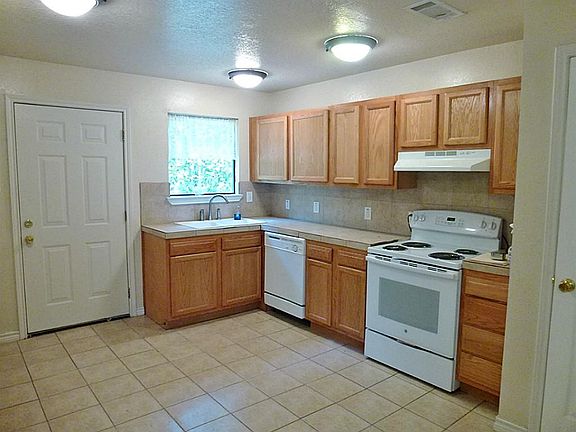 2011 New cabinets, tile counters, and stove.