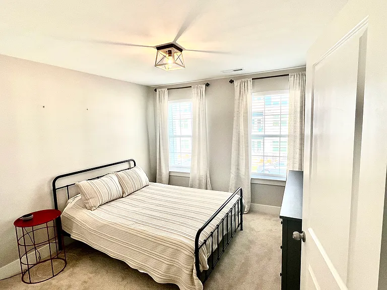2nd bedroom with queen bed and dresser