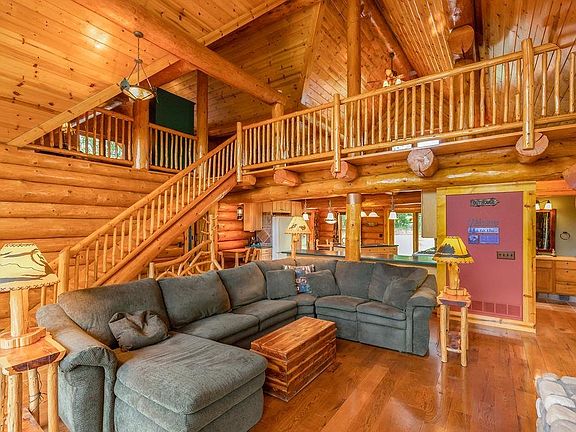 The main level has soaring ceilings and open to the loft