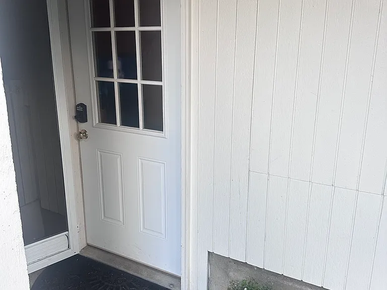 Front entrance with screen door.