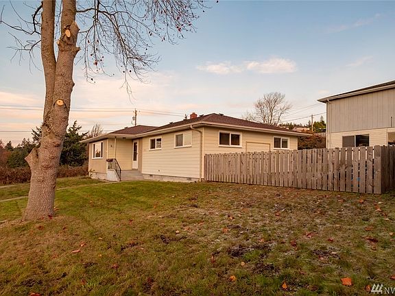 From the front south yard facing north. This space offers potential for a garage or workshop. 
