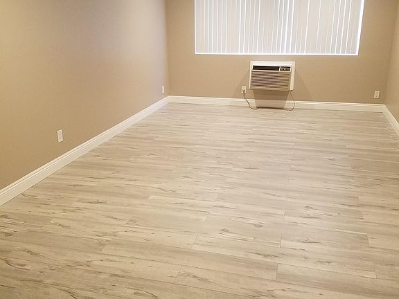Space for king-sized bed & recently installed air conditioner.