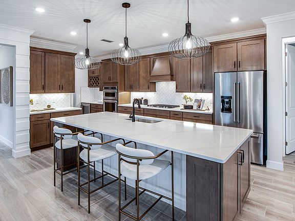 Pro-series kitchen featuring stainless steel appliances, conceptual