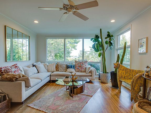 Living room with original bay windows with river view