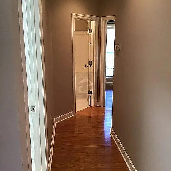 Hallway to Utility Room, 2nd Bathroom, and 3rd Bedroom