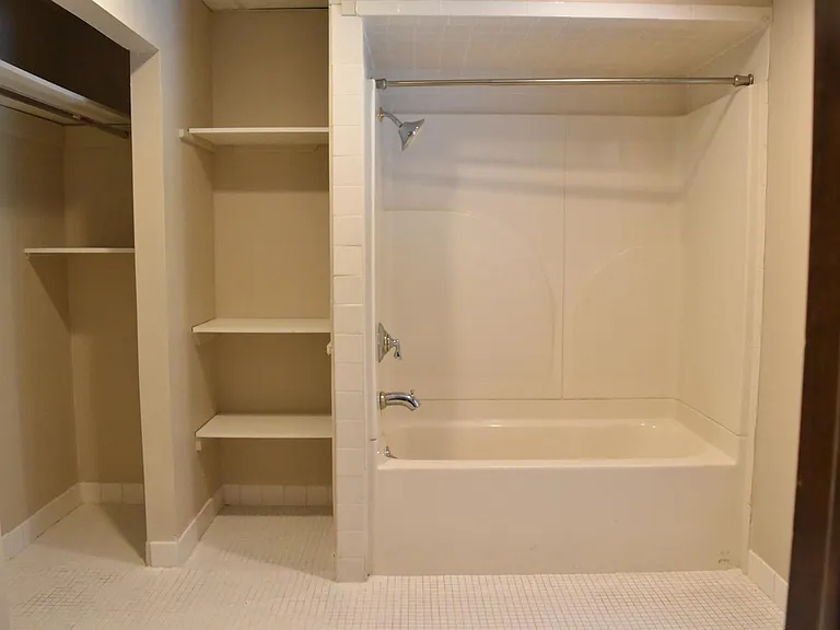 full bathroom shower/tub combo and closets