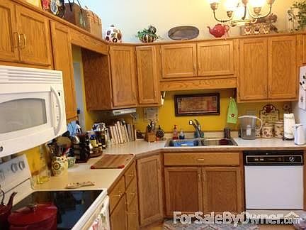 Formal dining room & living room.
						:
						Kitchen & formal dining room has laminate flooring & high vaulted ceiling.