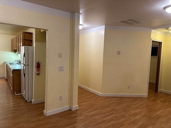 livingroom looking towards smaller bedrooms, hallway to master & main bath, and looking towards kitchen. open living/kitchen.
