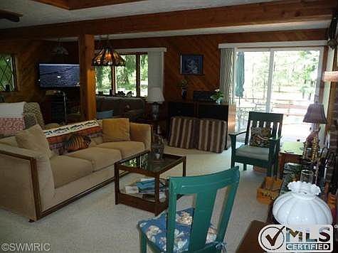 The Great Room has a beautiful view of the river and two seating areas: one for TV viewing and anoth