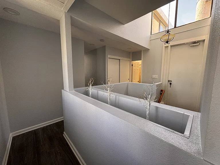View into 2nd Floor Hallway, Closet space and washer and dryer, 2nd Bathroom, Rooftop Access door