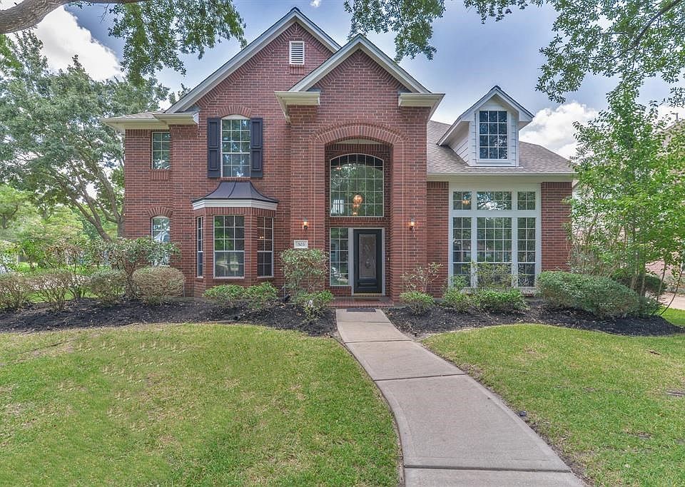 Front view of this home that is most admired in the neighborhood.