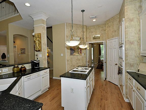 Kitchen also features nice flooring and plenty of storage space.