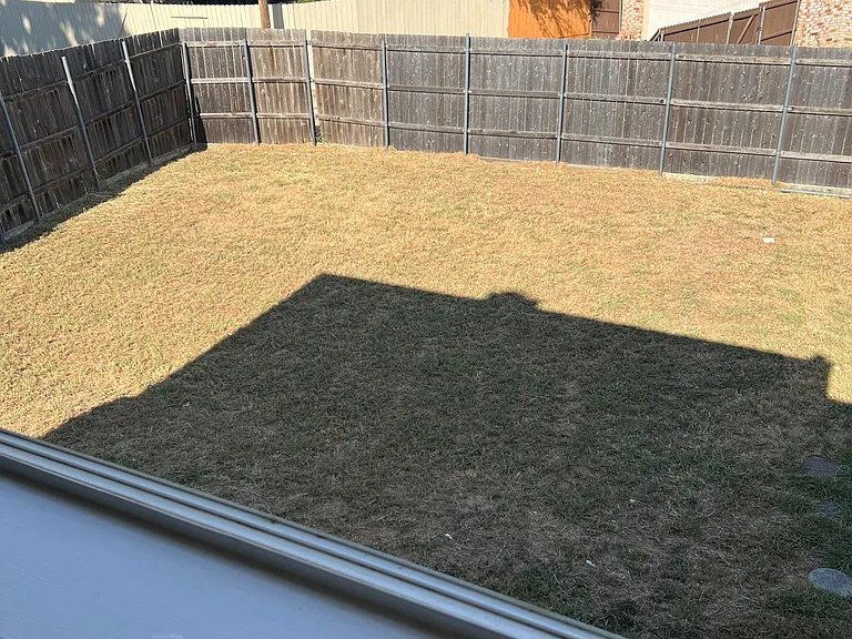 Large fenced backyard.