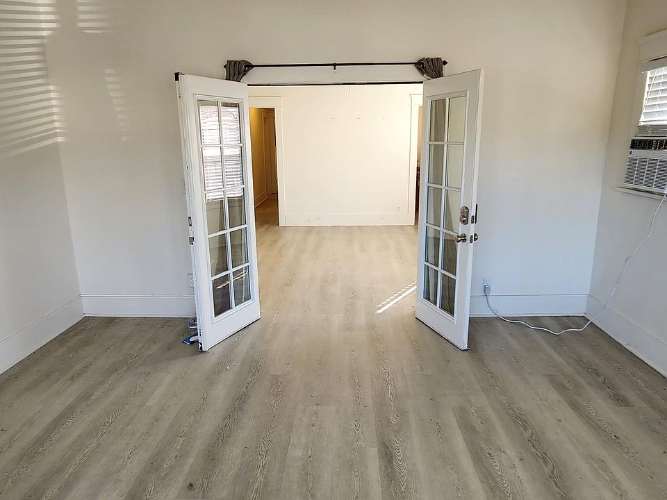 Inside 1st Bedroom looking back at French doors. Bedroom can also be used as family room or office