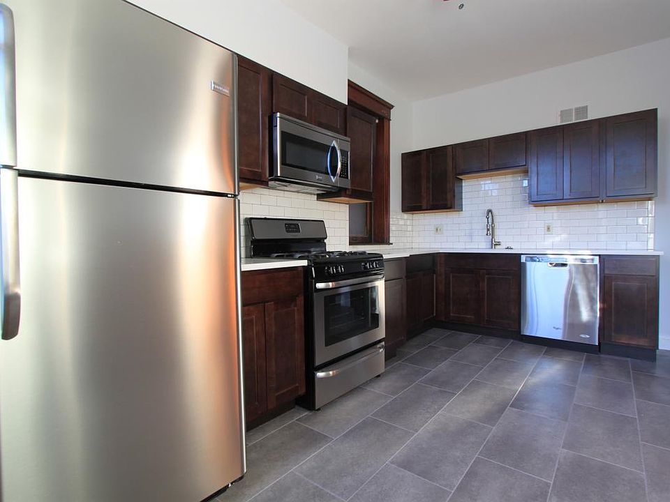 Remodeled kitchen with quartz countertops, new appliances in