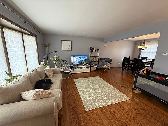 Bay window with newly painted living and dinning room. Newly finished hardwood flooring.