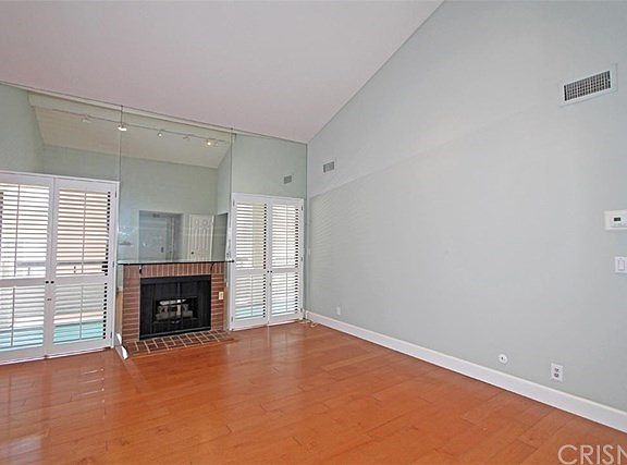 Spacious living room with vaulted ceilings.